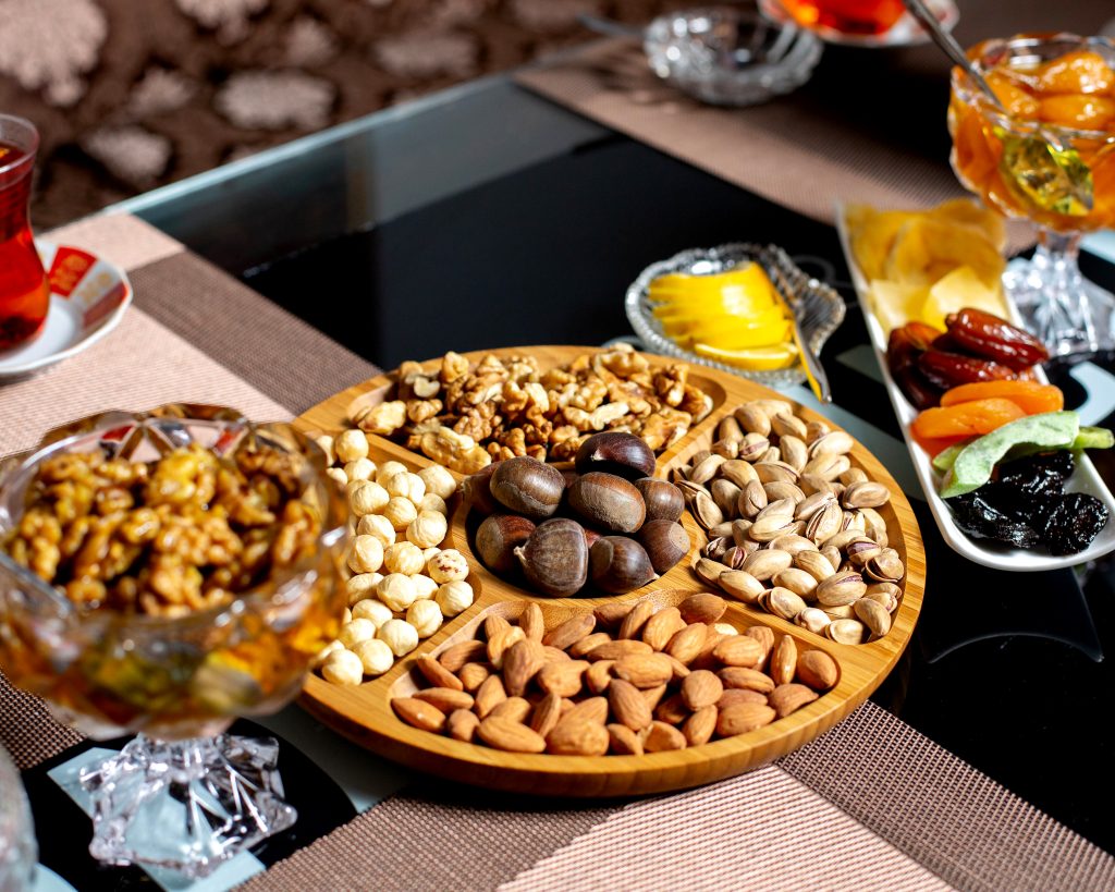 wooden plate with lots of various nuts